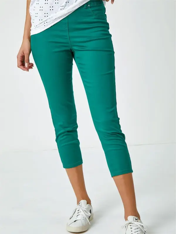 Green skinny trousers