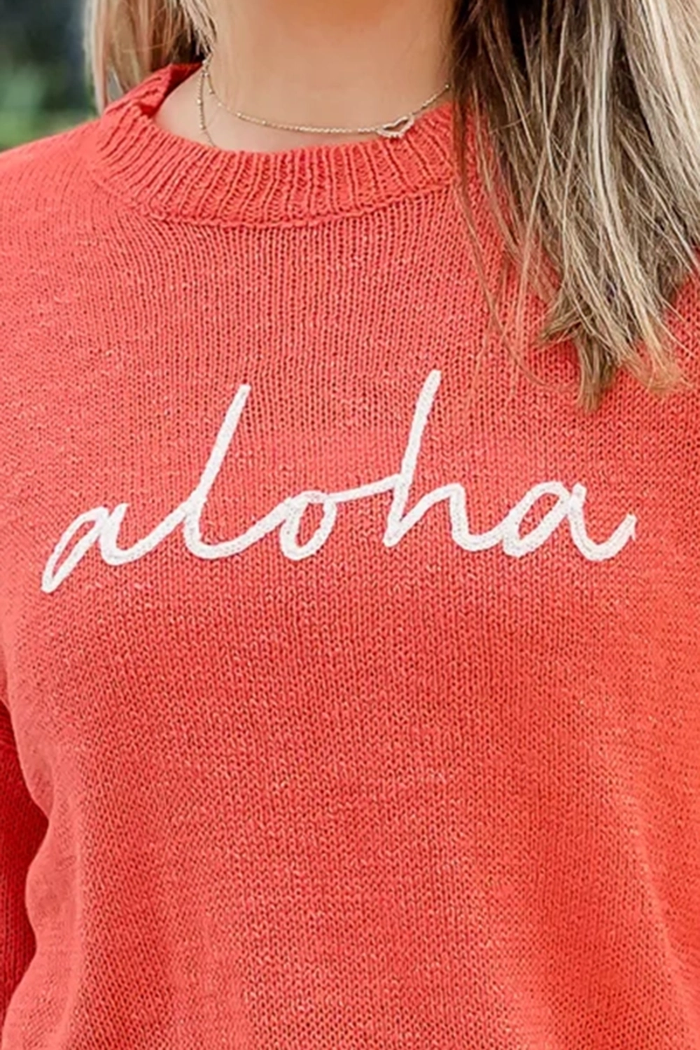 Red and orange letter sweater