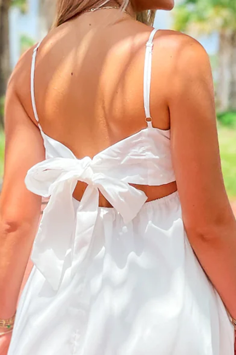 Short dress with bow tie at back