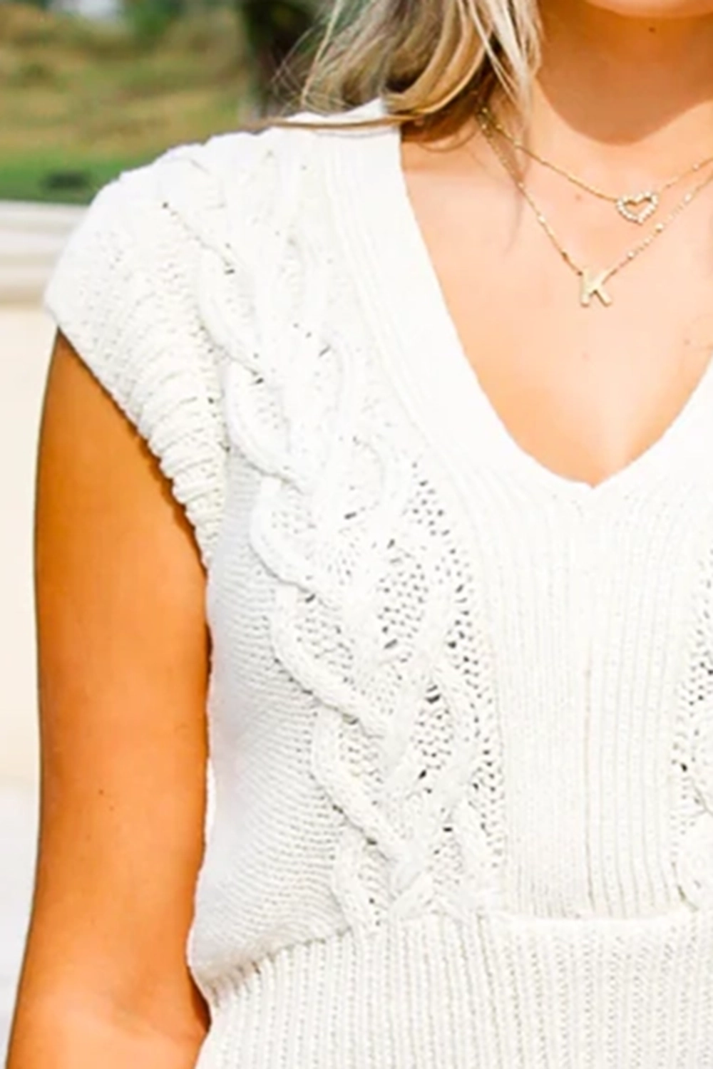 V-neck white twisted knit sweater